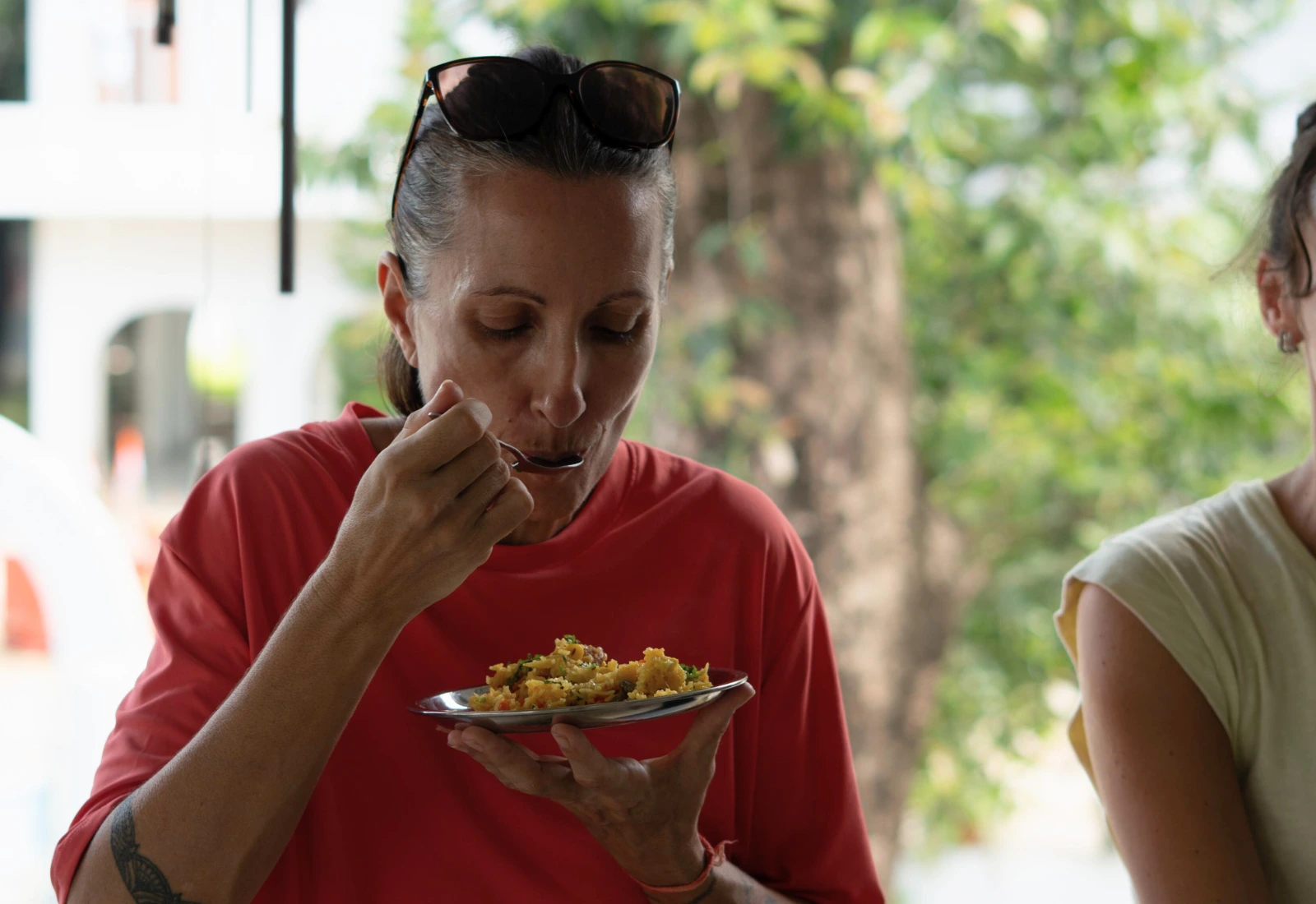 Yoga TTC student eating poha meal at Atharv Yogshala