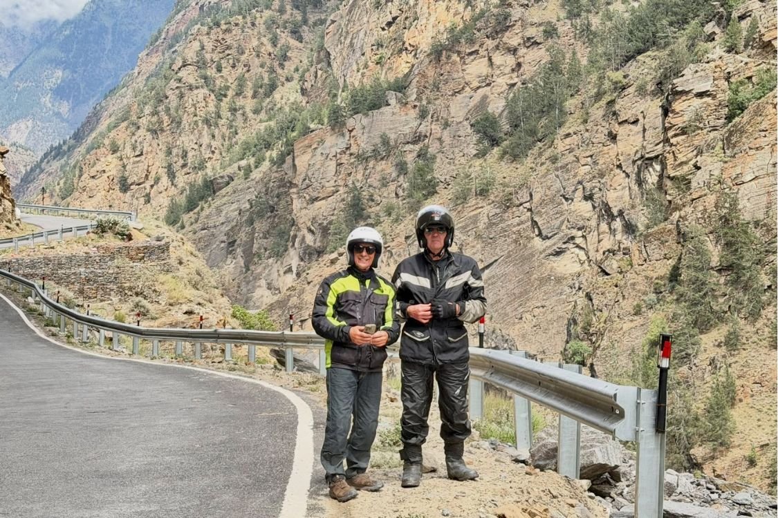 Bikers riding through scenic Uttarakhand Himalayan roads