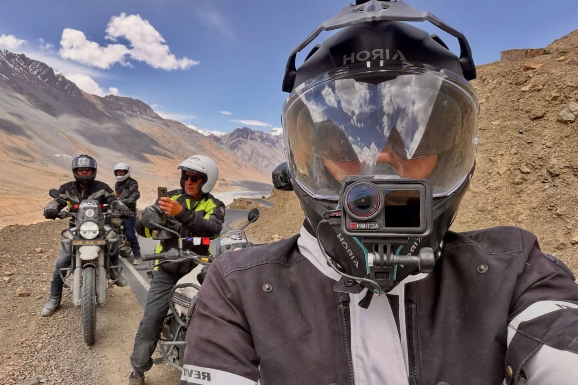 Riders on mountain bikes exploring Uttarakhand Himalayan terrain