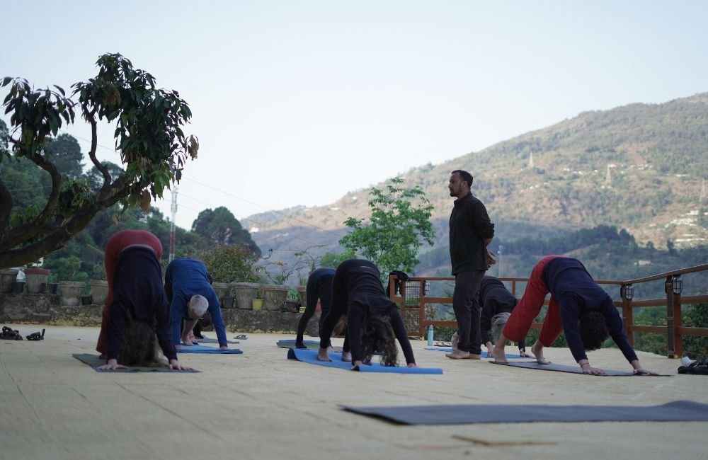 Riders at Tungnath temple trek during Himalayan motorcycle yoga retreat