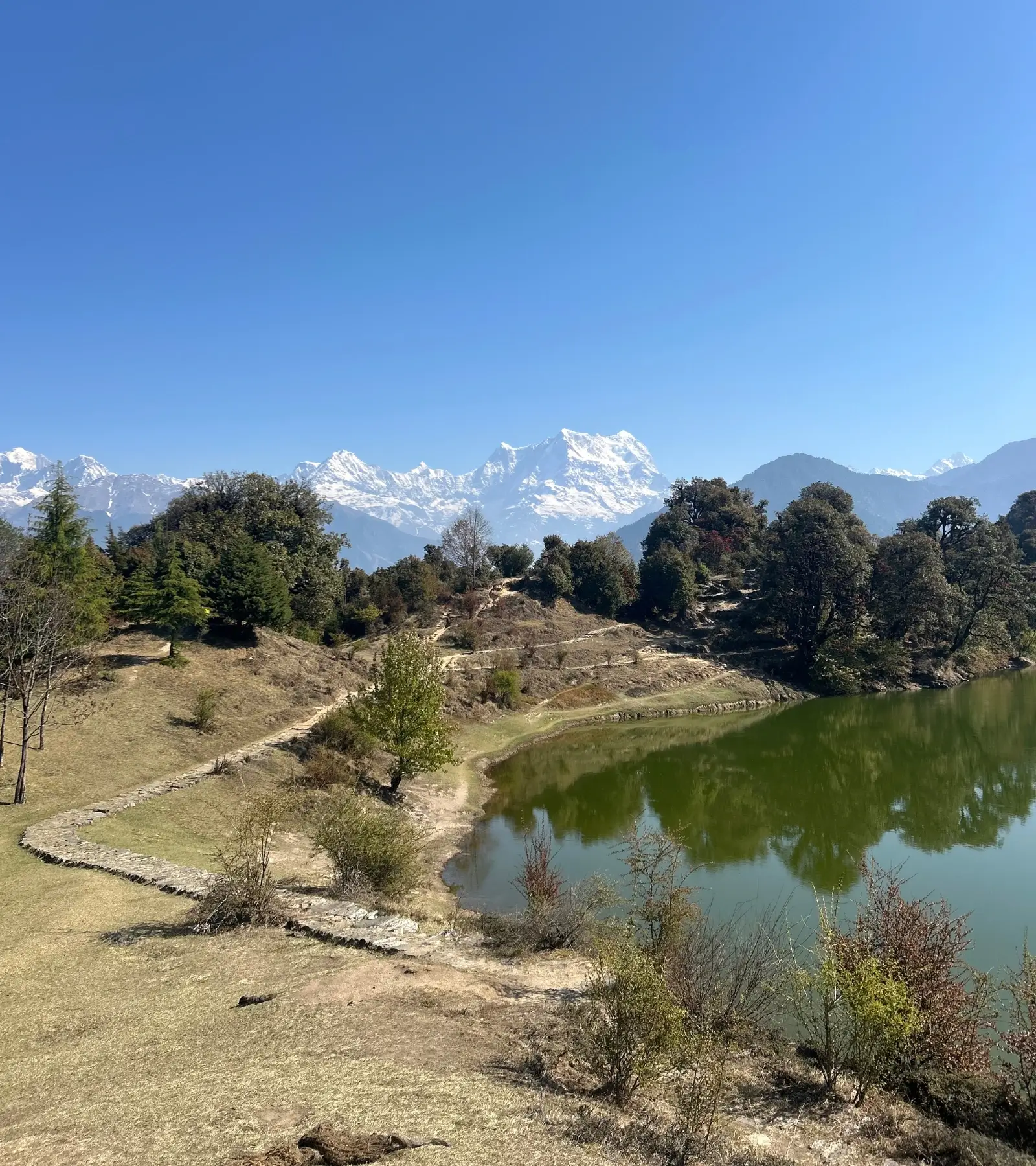 Serene Deoria Tal lake reflecting Chaukhamba peak