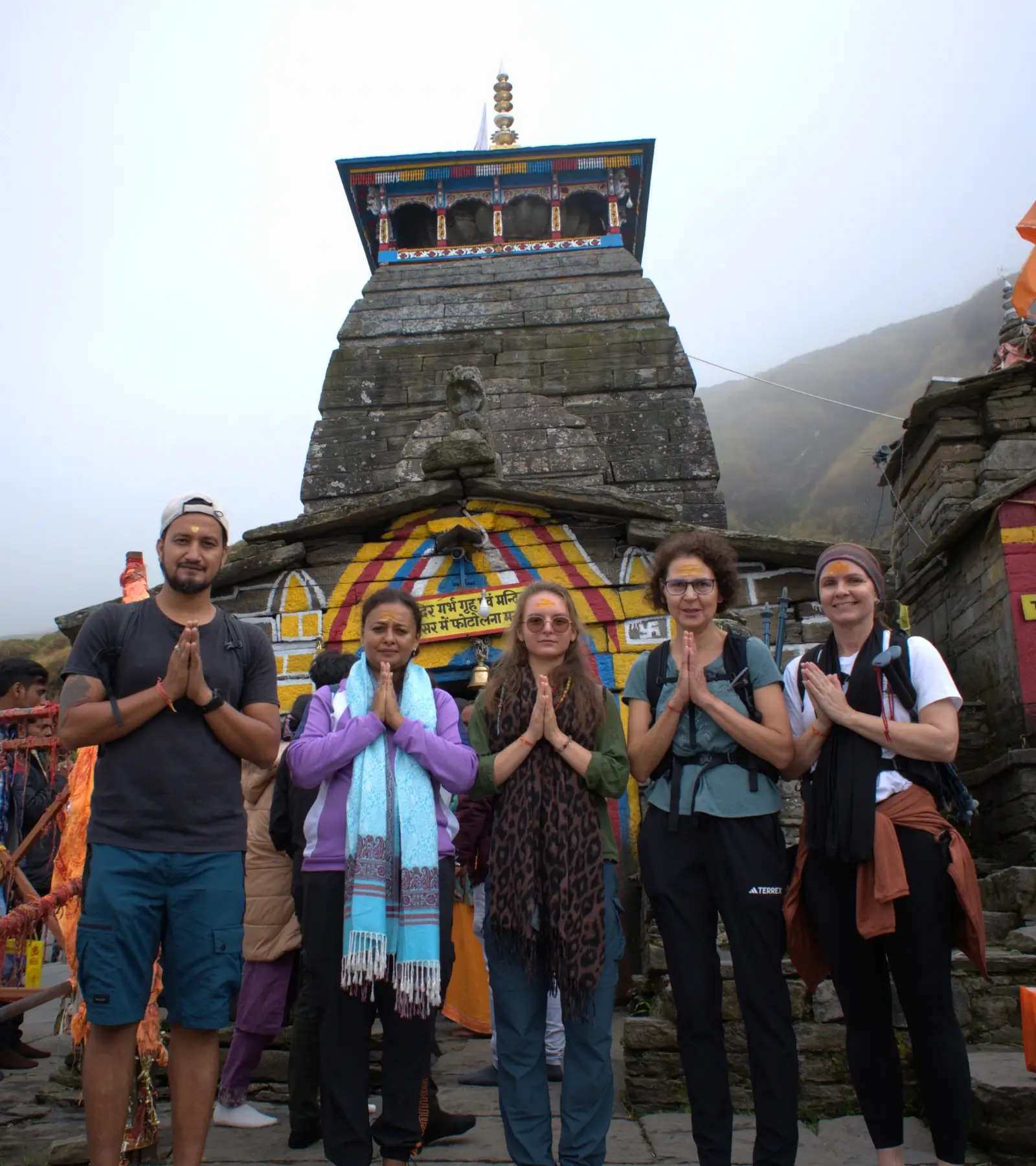 Ancient Tungnath Temple against a backdrop of Himalayan peaks